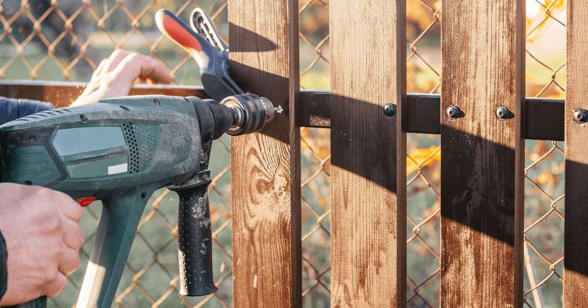 hand-of-carpenter-holding-electric-drill-for-makin-2023-11-27-05-33-14-utc1